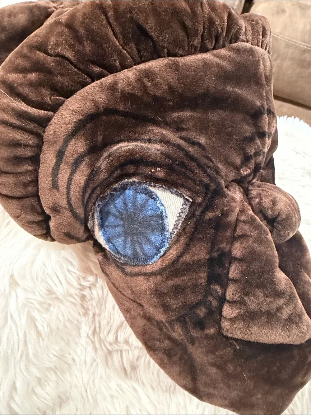 ET. Brown Plush Novelty Accent Pillow with Blue Eye
